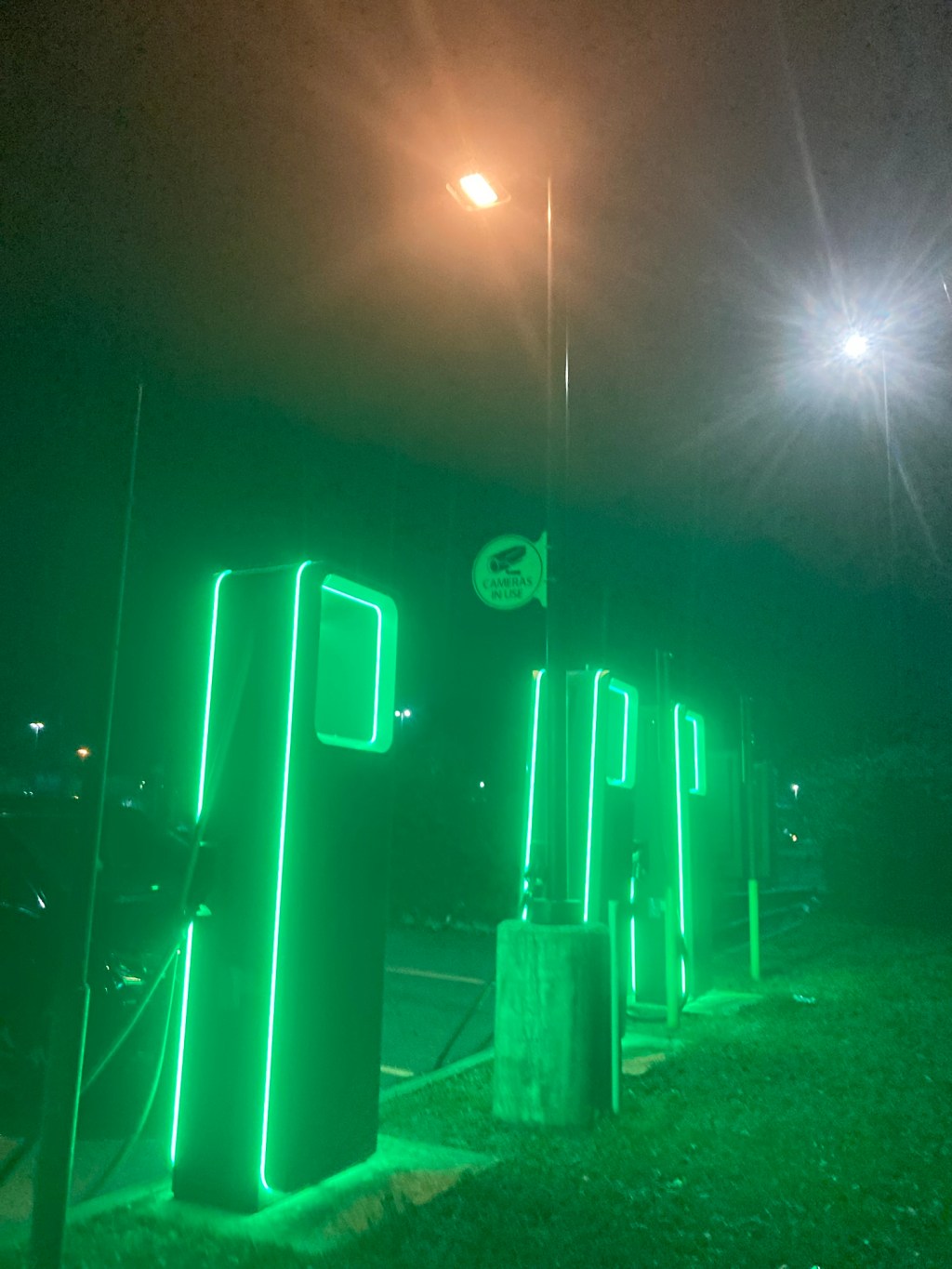 The glow from an Electrify America charging station in Chipley, Florida.