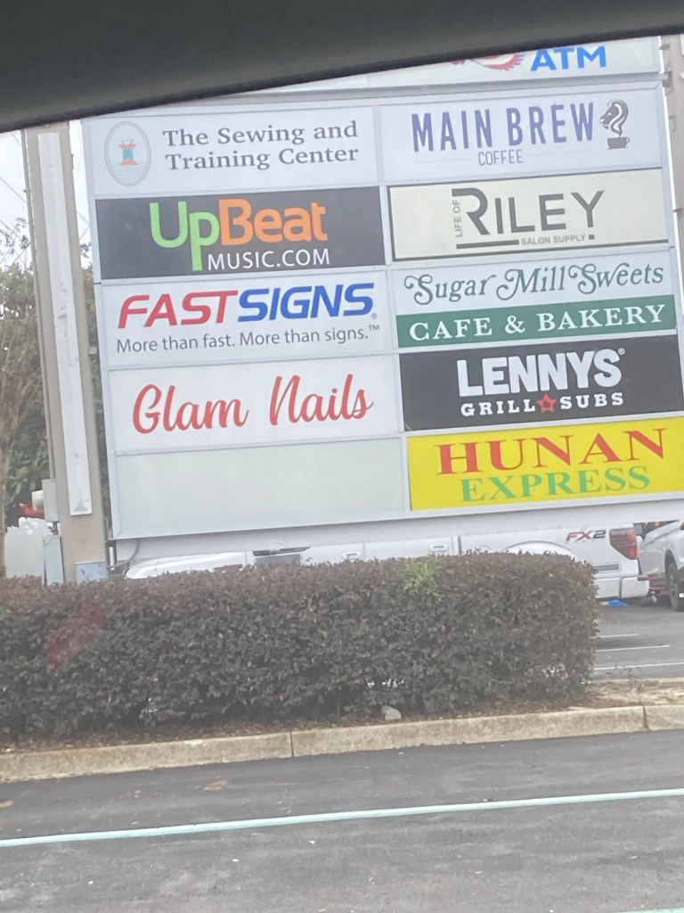 The sign for Wright Plaza, where the FPL Evolution charging station is.